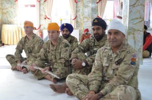 Delegation gracefully listens to Guru Granth Sahib Ji’s message in the Gurudwara