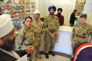 Guests listen intently to the ethos and values driving the Nishkam Health Centre