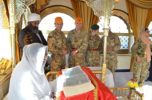 Nishkam Centre Director and guests pay respects to Guru Granth Sahib Ji in the                      Gumbad (Dome) Darbar