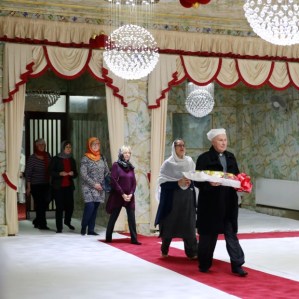 Archbishop in Main Darbar Sahib and about to present a bouquet of flowers to Guru Granth Sahib Ji