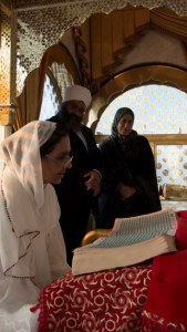 Dr Marzouk listens as prayers are recited from Sri Guru Granth Sahib Ji in the Gumbad Darbar (Dome Prayer Room)
