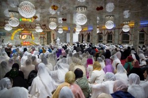 The Sangat (congregation) listen to prayers being recited from Sri Guru Granth Sahib Ji